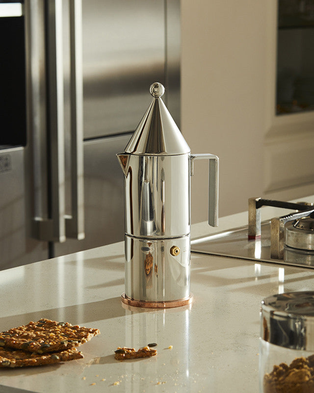 Personalisable stovetop espresso coffee maker in polished stainless steel and copper. An elegant gift idea for coffee lovers featuring straight edges and conical lid.
